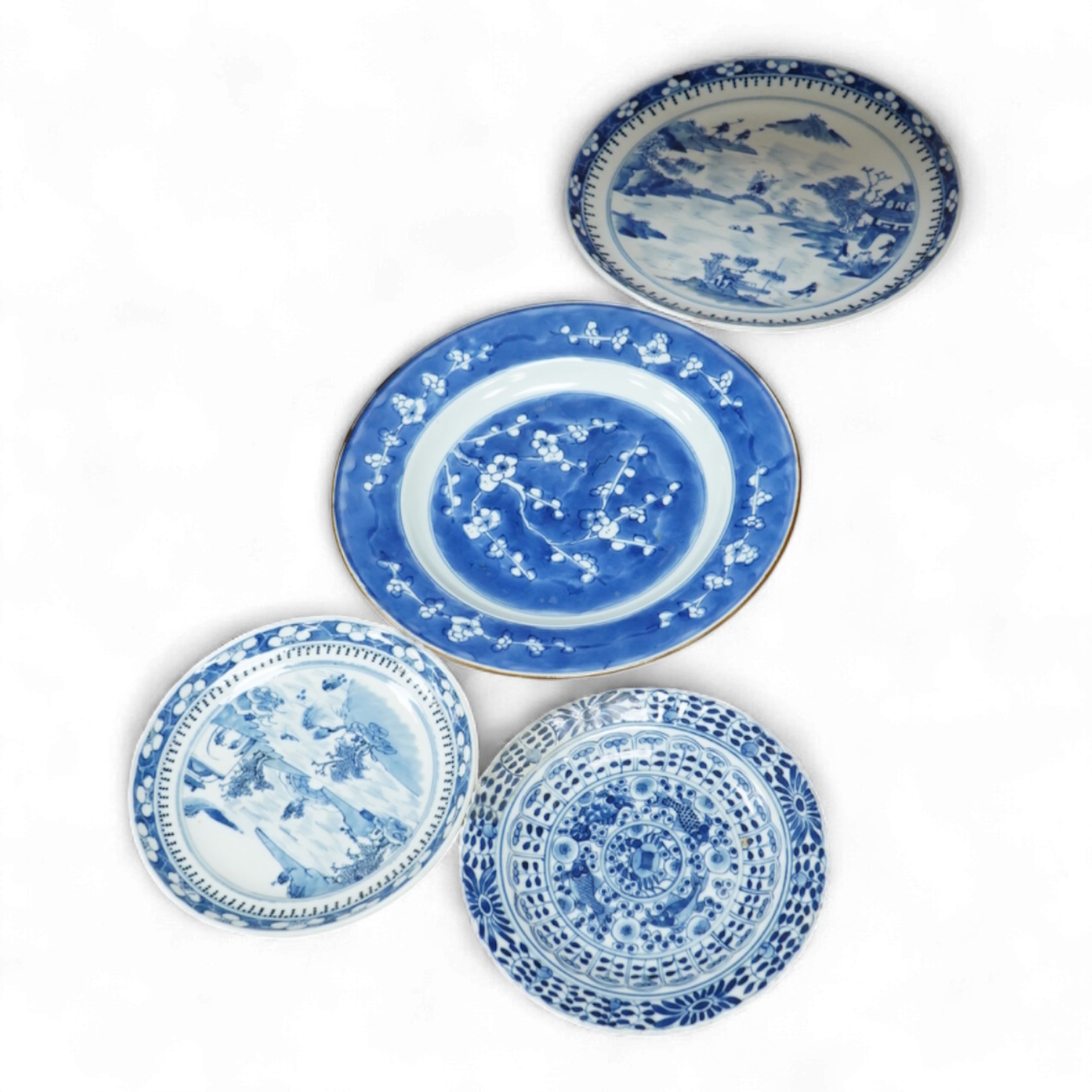 A 19th century Chinese blue landscape plate another smaller, prunus plate, another with restored rim, largest 22.5cm diameter.